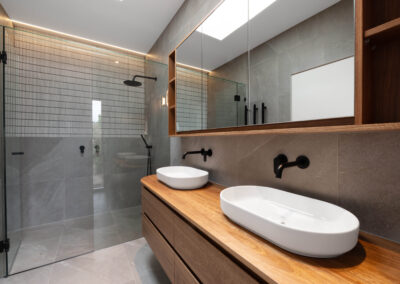 ensuite extension by Vivid Build on brick clinker hughesdale property